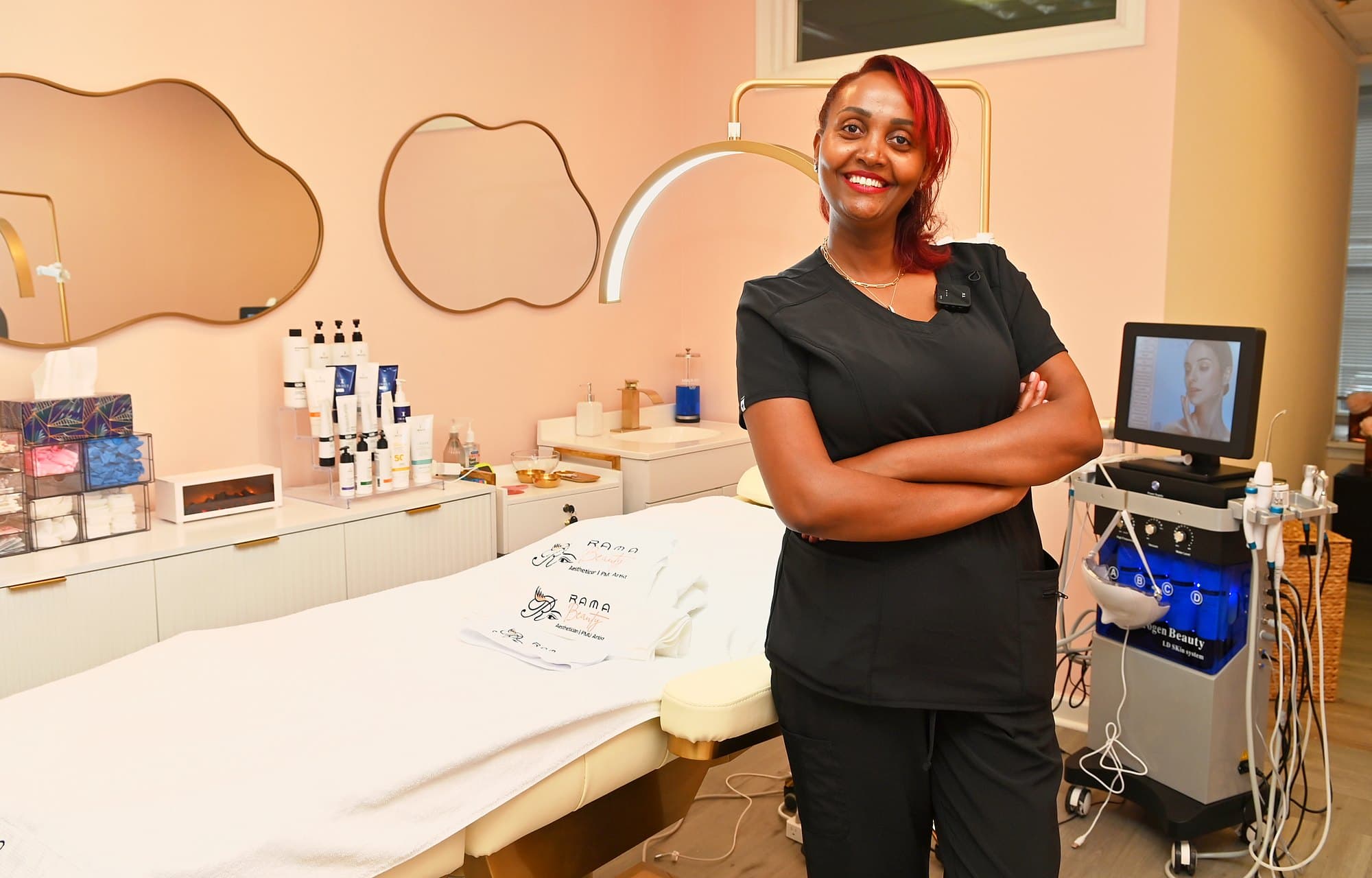 Rahwa in black scrubs in her treatment room at Rama Beauty